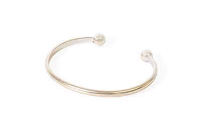 Lot 79 - A 9 Carat White Gold Torque Bangle, inner...