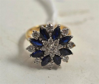 Lot 197 - A 9ct gold sapphire and diamond cluster ring, round brilliant cut diamonds and marquise cut...