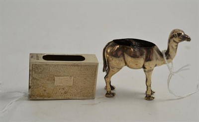 Lot 203 - Silver matchbox holder and silver camel pin cushion