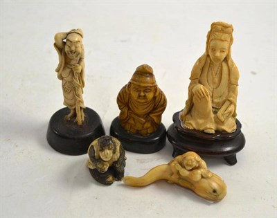 Lot 206 - Four netsukes and a faux ivory seated figure