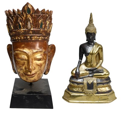 Lot 230 - A South-East Asian Carved Giltwood Head of...