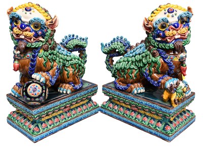 Lot 222 - A Pair of Oriental Porcelain Lion Dogs, in...