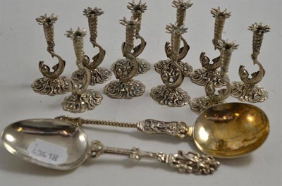 Lot 222 - Two ornate Dutch silver spoons and a set of ten Italian '800' dolphin tapersticks