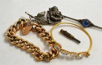 Lot 225 - A curb link bracelet, a stone set bangle, cabochon bar brooch and a marcasite bar brooch