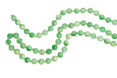 Lot 141 - A Jade Bead Necklace, the uniform beads...