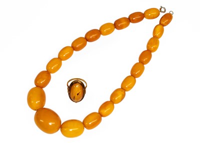 Lot 45 - A Graduated Amber Bead Necklace, length 39cm;...