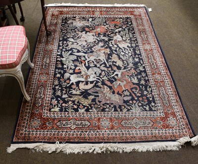 Lot 383 - Kashmir Silk-Piled Rug, the deep indigo field...