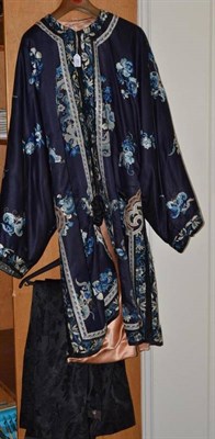 Lot 281 - Chinese navy blue silk jacket, with applique trims and embroidered with flowers and...