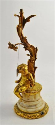 Lot 286 - A gilt metal Rococo style table lamp base mounted with a cherub