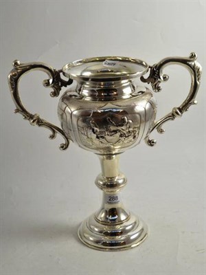 Lot 288 - A white metal twin handled trophy cup with Oriental figures