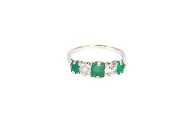 Lot 46 - An Emerald and Diamond Five Stone Ring, three...