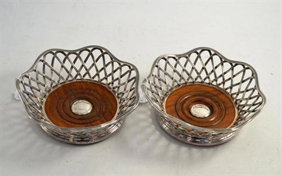 Lot 301 - Pair of Elkington plated basket-weave large decanted coasters, date codes for 1860