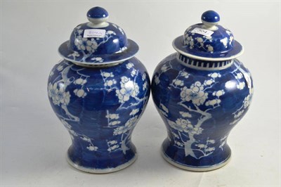 Lot 304 - A pair of Japanese blue and white vases and covers