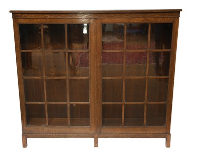 Lot 524 - A 1930s Oak Bookcase, with two glazed doors...