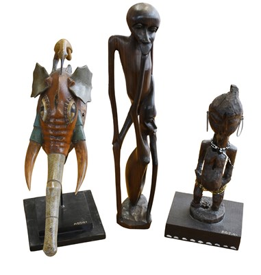 Lot 404 - A Makonde Ebony Devil Carving, circa 1979; two...