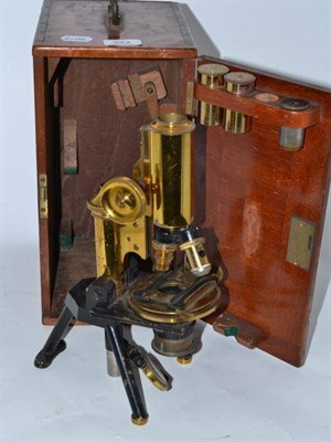 Lot 322 - A cased microscope