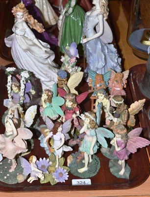 Lot 324 - Two Coalport figures of fairies and a quantity of fairy collection figures, the golden chariot...