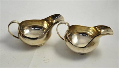 Lot 332 - A pair of silver sauce boats, by Charles S Green Ltd, Birmingham 1955 & 1958