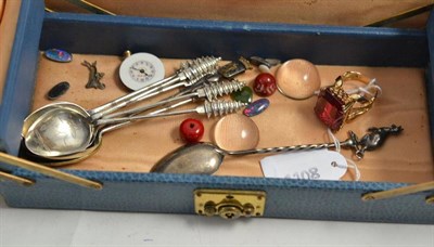 Lot 339 - Silver gilt and red stone ring, a silver kangaroo spoon, seven other spoons and oddments in a...