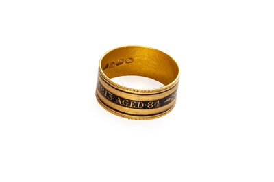 Lot 36 - An Enamel Mourning Ring, the broad band...