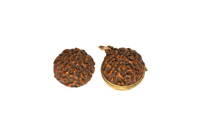 Lot 115 - A Carved Locket, in the form of a nut,...