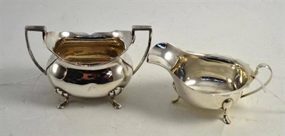 Lot 351 - A silver twin handled sugar bowl and a silver sauce boat