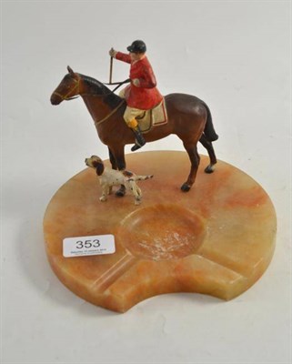 Lot 353 - A cold painted spelter figure of a huntsman on horseback with a shaped onyx ashtray