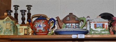 Lot 365 - A shelf of eight Royal Doulton character jugs, teapots, candlesticks etc