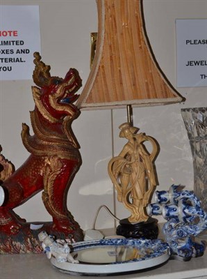 Lot 369 - A German porcelain girandole, a lamp and a dragon figure