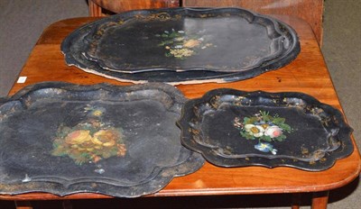 Lot 380 - A Victorian oval papier mache tray painted with a floral spray and inlaid with mother of pearl...