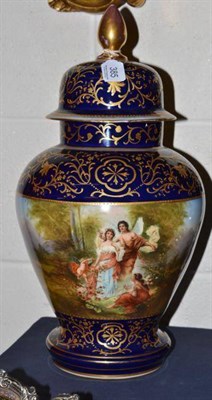 Lot 385 - A Vienna style blue and gilt vase and cover