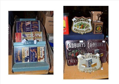 Lot 402 - Seven Cadbury's glass advertising signs, two Cadbury's tins and two Cadbury's display stands (11)