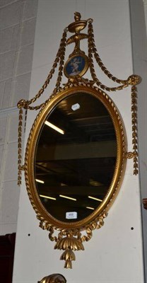 Lot 468 - Oval gilt framed wall mirror