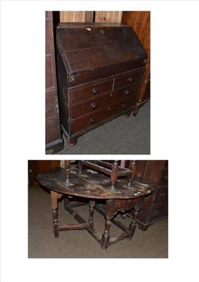 Lot 480 - A Georgian oak bureau and a Georgian oak drop leaf table