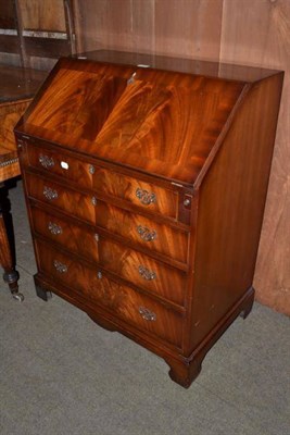 Lot 485 - A reproduction mahogany bureau