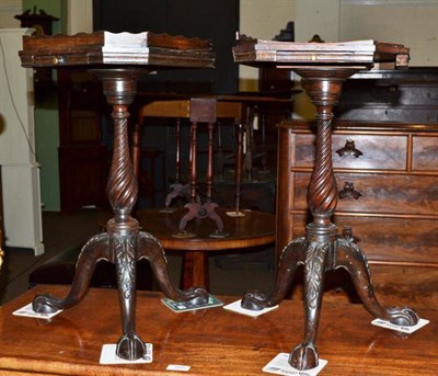 Lot 506 - A pair of mahogany urn stands