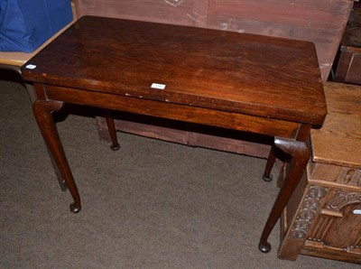 Lot 516 - A mahogany fold-over card table