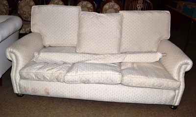 Lot 529 - A small three seater sofa and a roll of fabric