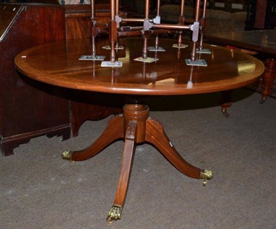 Lot 545 - A reproduction mahogany cross banded circular breakfast table