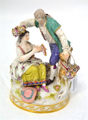 Lot 64 - A Meissen Porcelain Figure Group, circa 1880, as a standing youth wearing a green jacket...