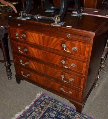 Lot 548 - A mahogany chest of drawers with brushing slide