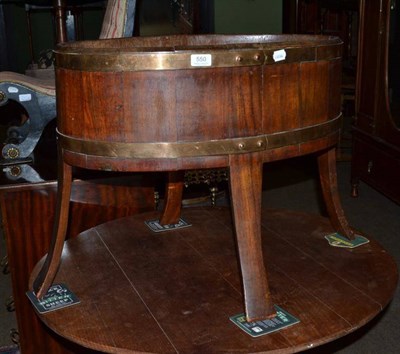 Lot 550 - A mahogany and brass coopered planter