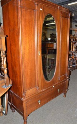 Lot 556 - An inlaid mahogany single door wardrobe