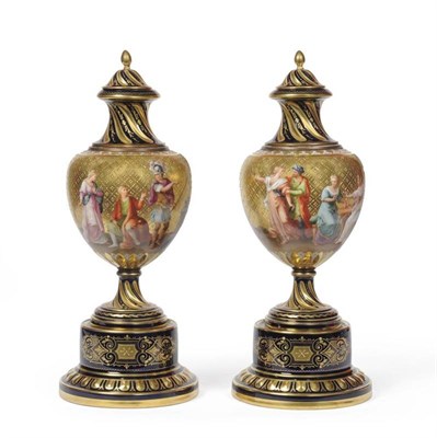 Lot 67 - A Pair of Vienna Style Porcelain Urn Shaped Vases and Covers, circa 1900, the wrythen covers...