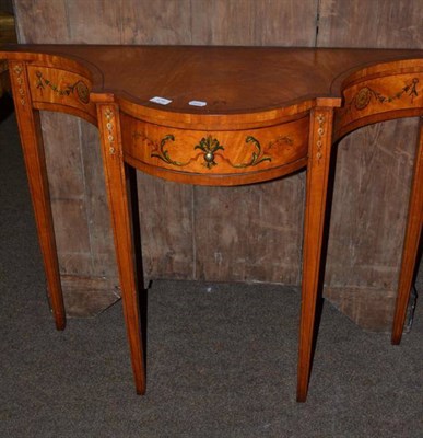 Lot 579 - A painted satin wood single drawer side table