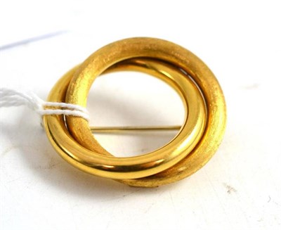 Lot 16 - A double loop brooch, stamped '750', part textured, part polished