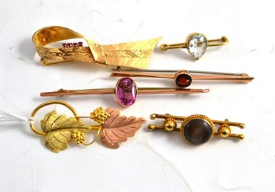 Lot 18 - A 9ct two colour gold leaf brooch, another brooch and four stone set bar brooches