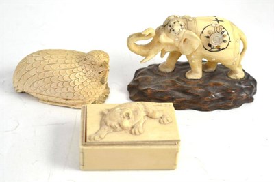 Lot 31 - Late 19th century ivory box decorated with a tiger, carved elephant figure and a bird ornament