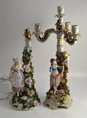 Lot 46 - Continental porcelain three branch candelabra, the Rococo base mounted with a woman and cherub,...