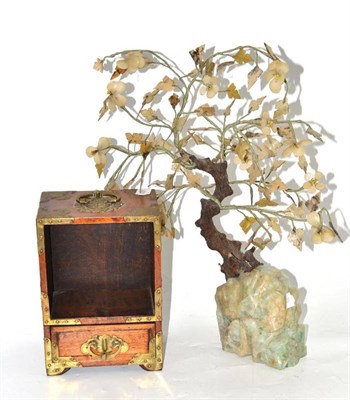 Lot 80 - A decorative tree ornament and a Chinese brass bound cabinet